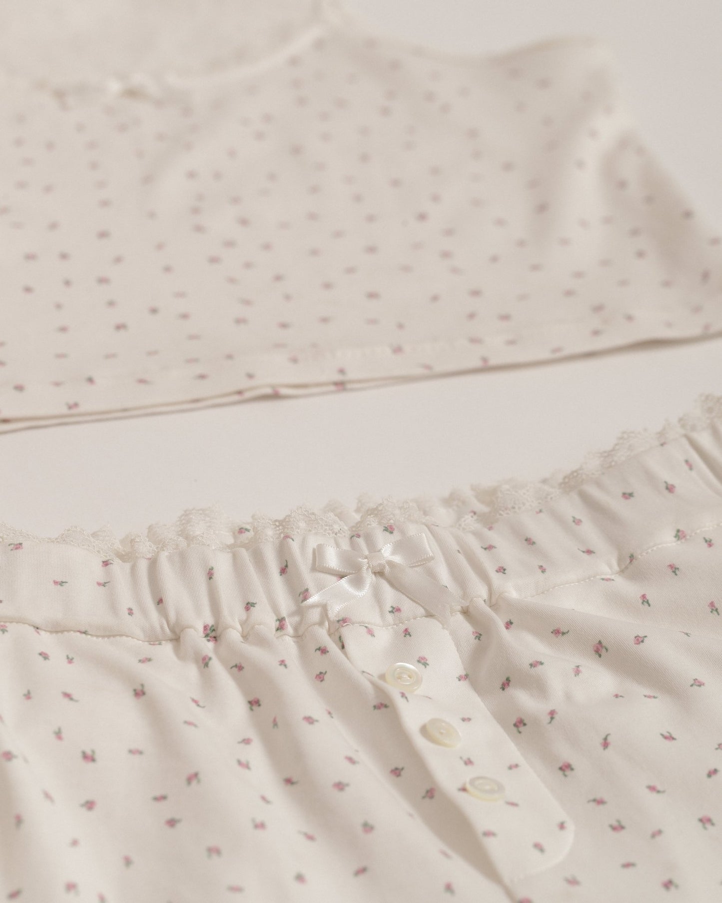 Isla Lune premium women’s cotton pajama set — breathable sleepwear for ritual and nighttime recovery, shown on two women in soft natural light.