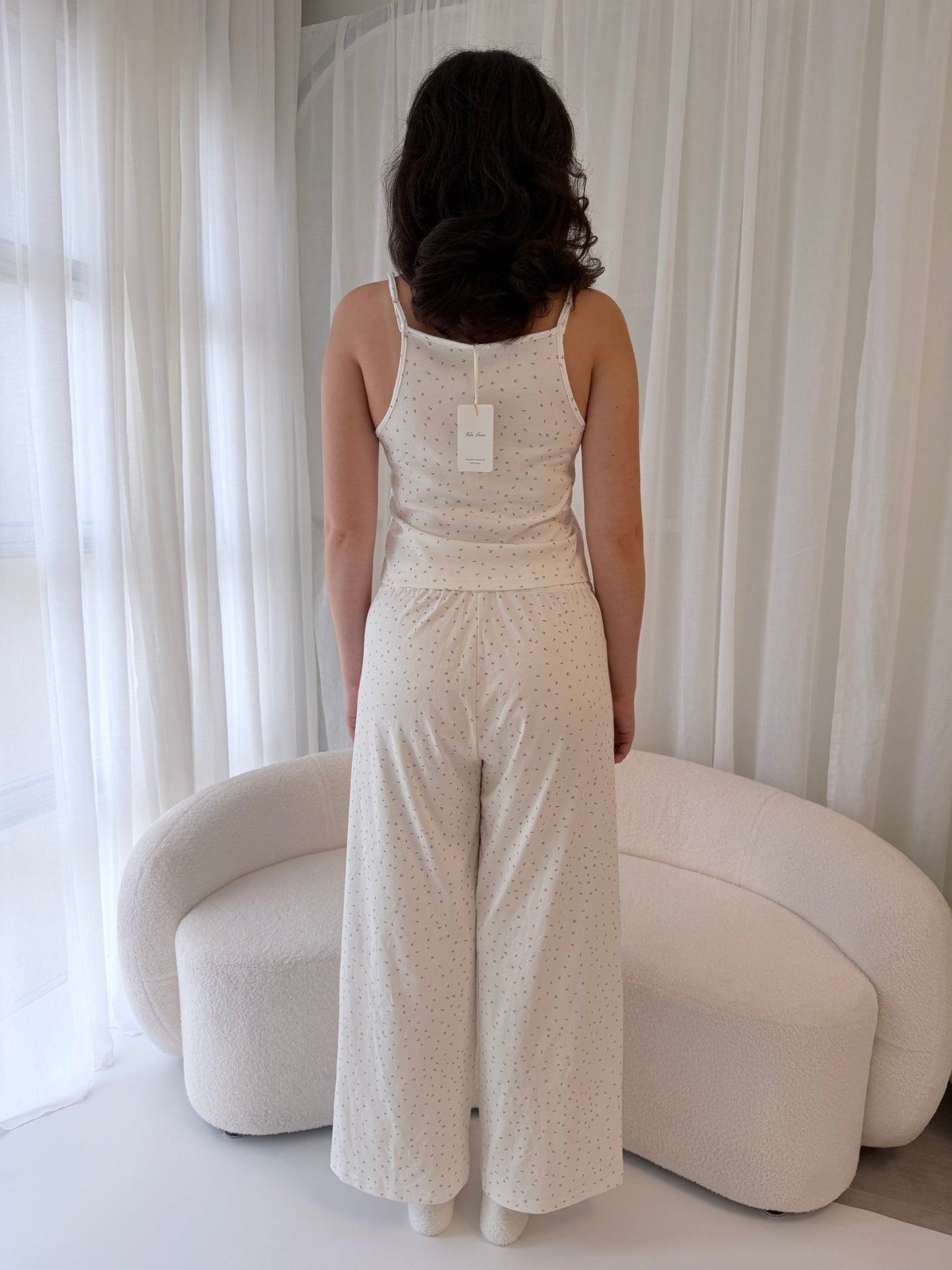 Isla Lune premium women’s cotton pajama set — breathable sleepwear for ritual and nighttime recovery, shown on two women in soft natural light.