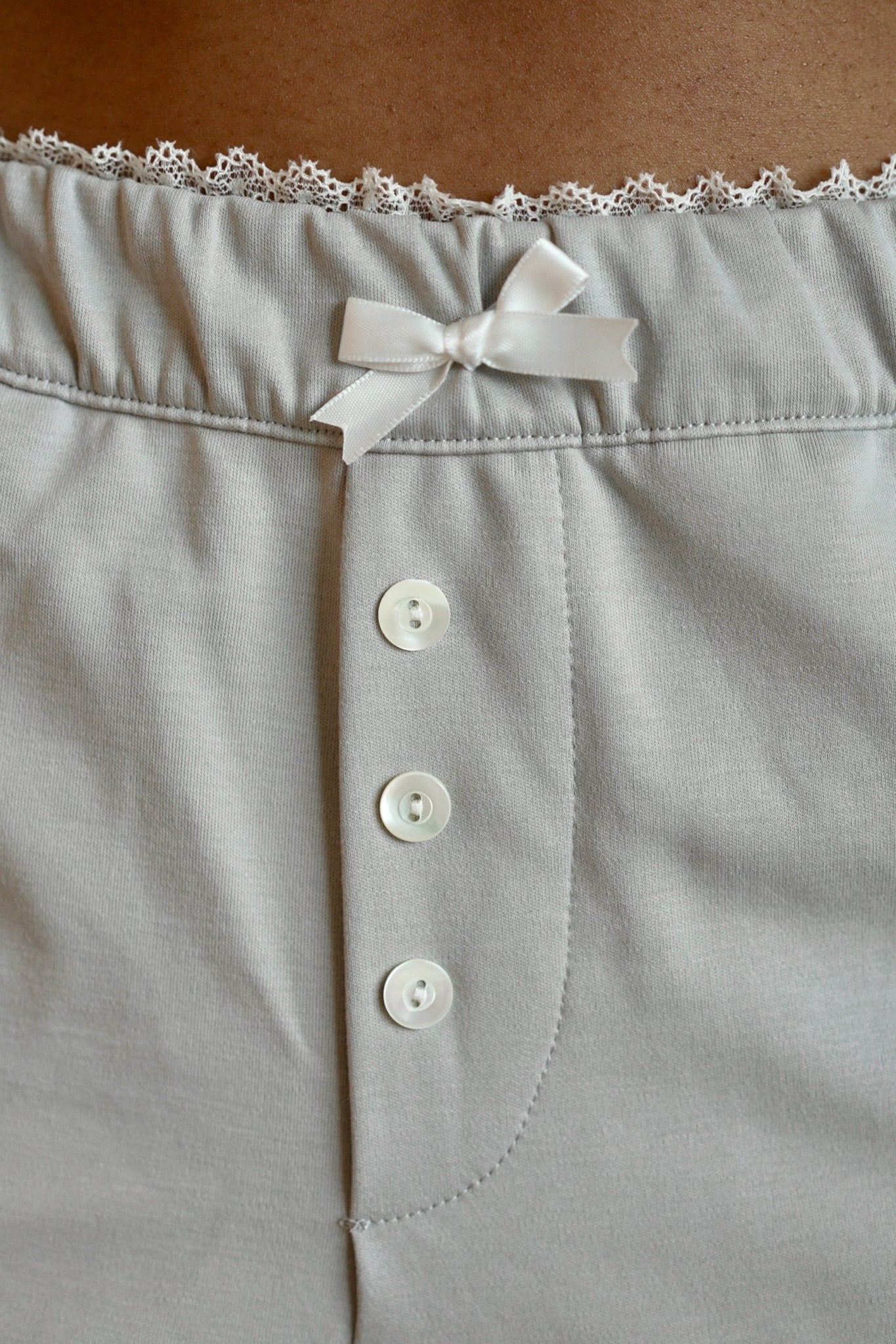 Isla Lune premium cotton pajama set - The Moonmilk Pants sleepwear for women, detail shot, dainty lace bow and buttons